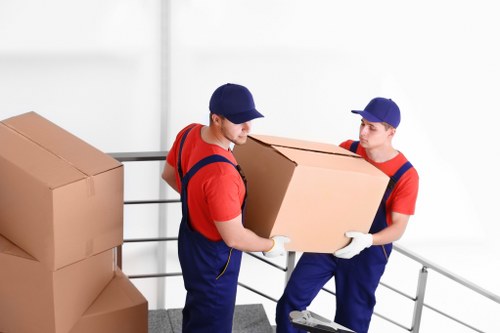 Loading furniture into a moving truck in central London