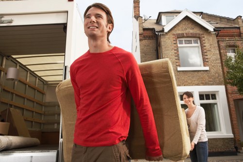 Packed boxes and household items being organised for transport